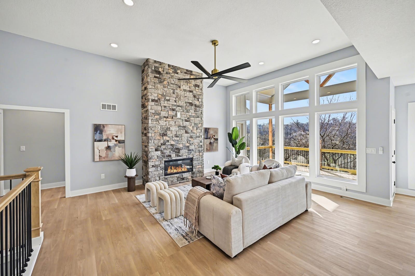 Vaulted great room with a wall of windows