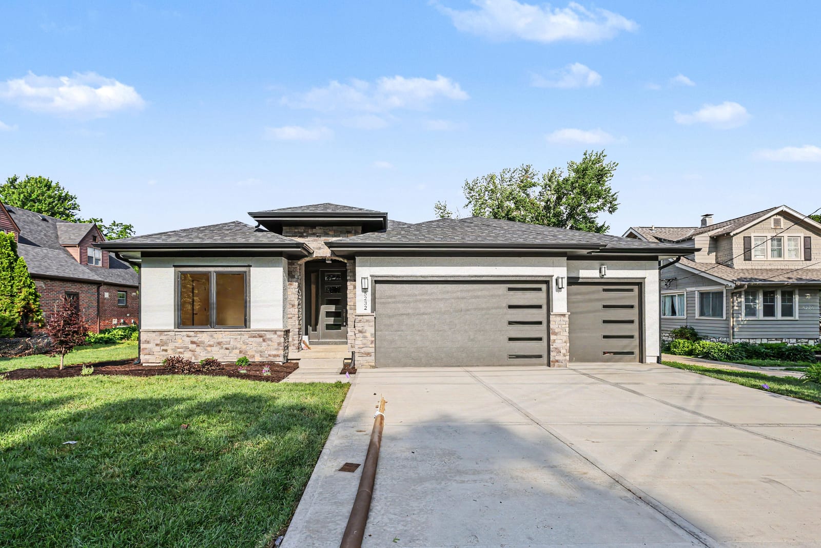 5232 Lowell St — stone and stucco exterior with two-car garage